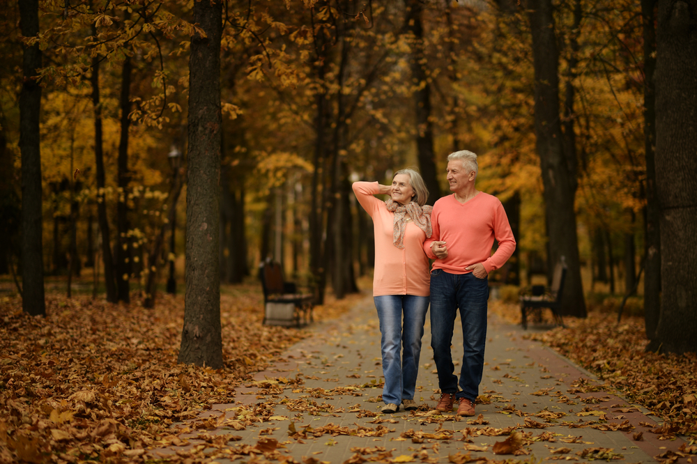 mature couple walking in autumn.jpg